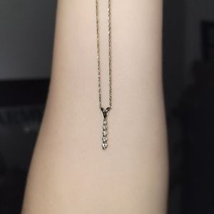 14k White gold diamond 5 tier drop stone pendant necklace.